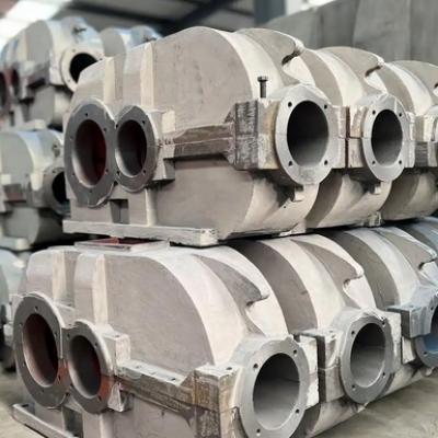 In addition to stress-relief annealing, what other methods can be used to reduce the stress in the gearbox housing?