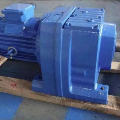 What factors affect the overall efficiency of the R series helical gear reducer